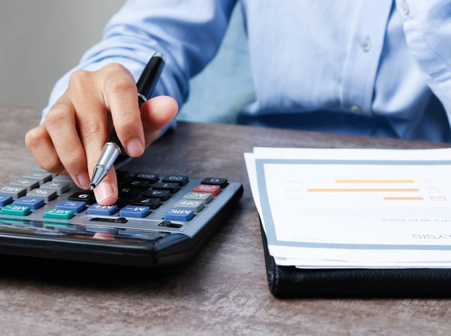 closeup economist using calculator 1