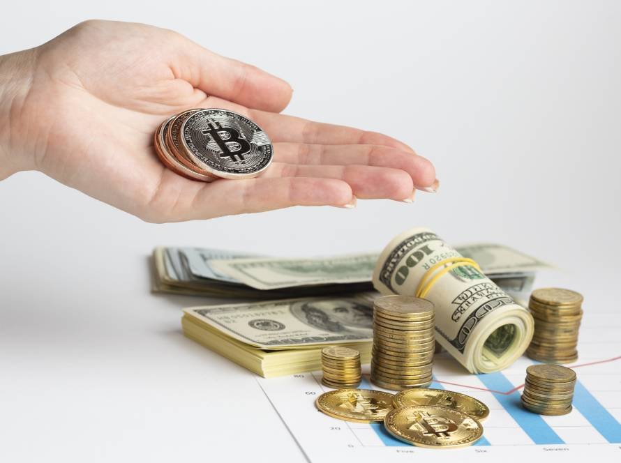 hand holding bitcoin money stack